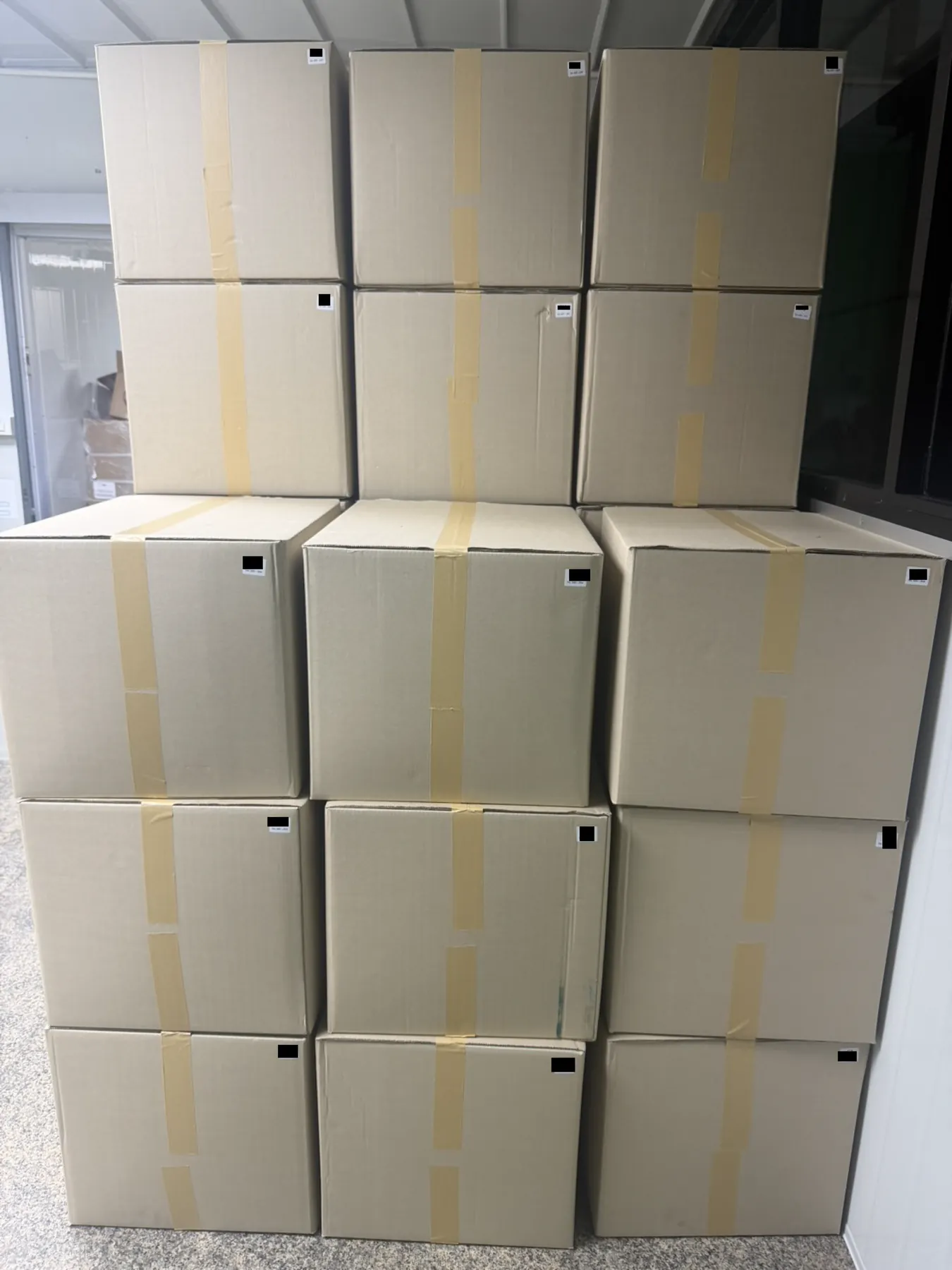 Sealed and taped export cartons stacked ready for dispatch